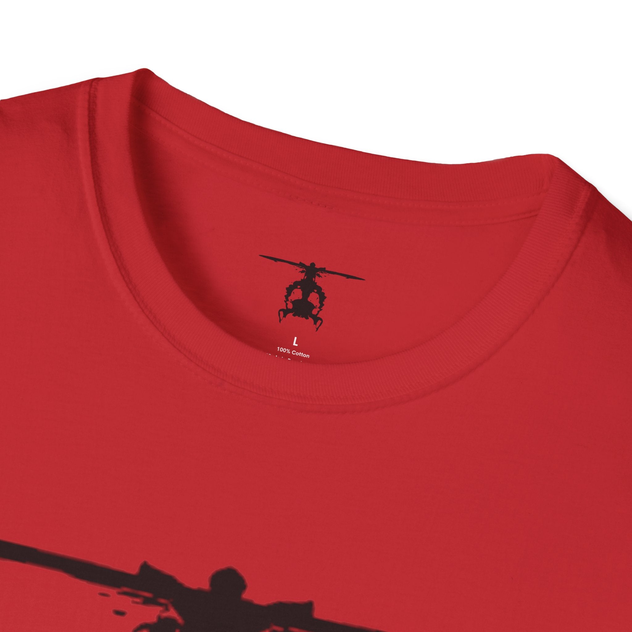 Red T shirt with an inkblot helicopter design on a white background