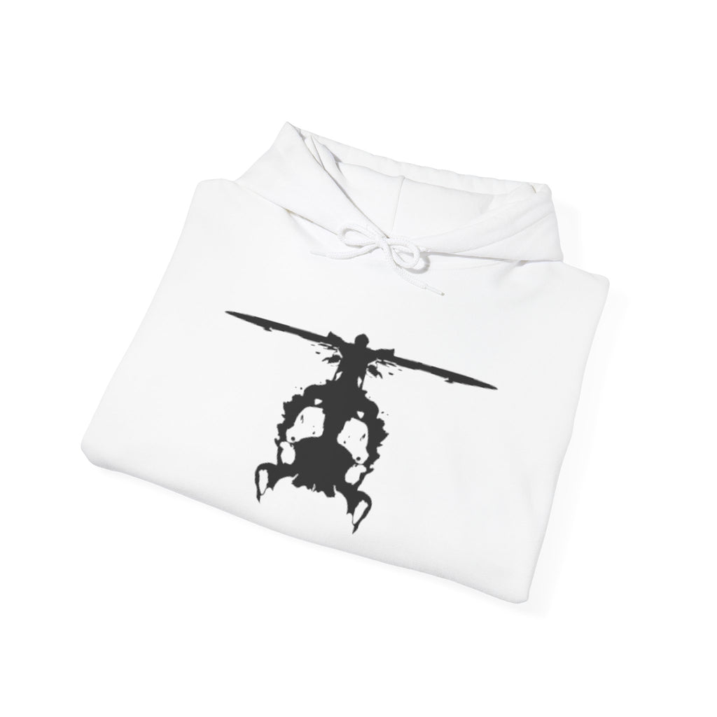 Folded white hoodie with an inkblot helicopter design on a white background