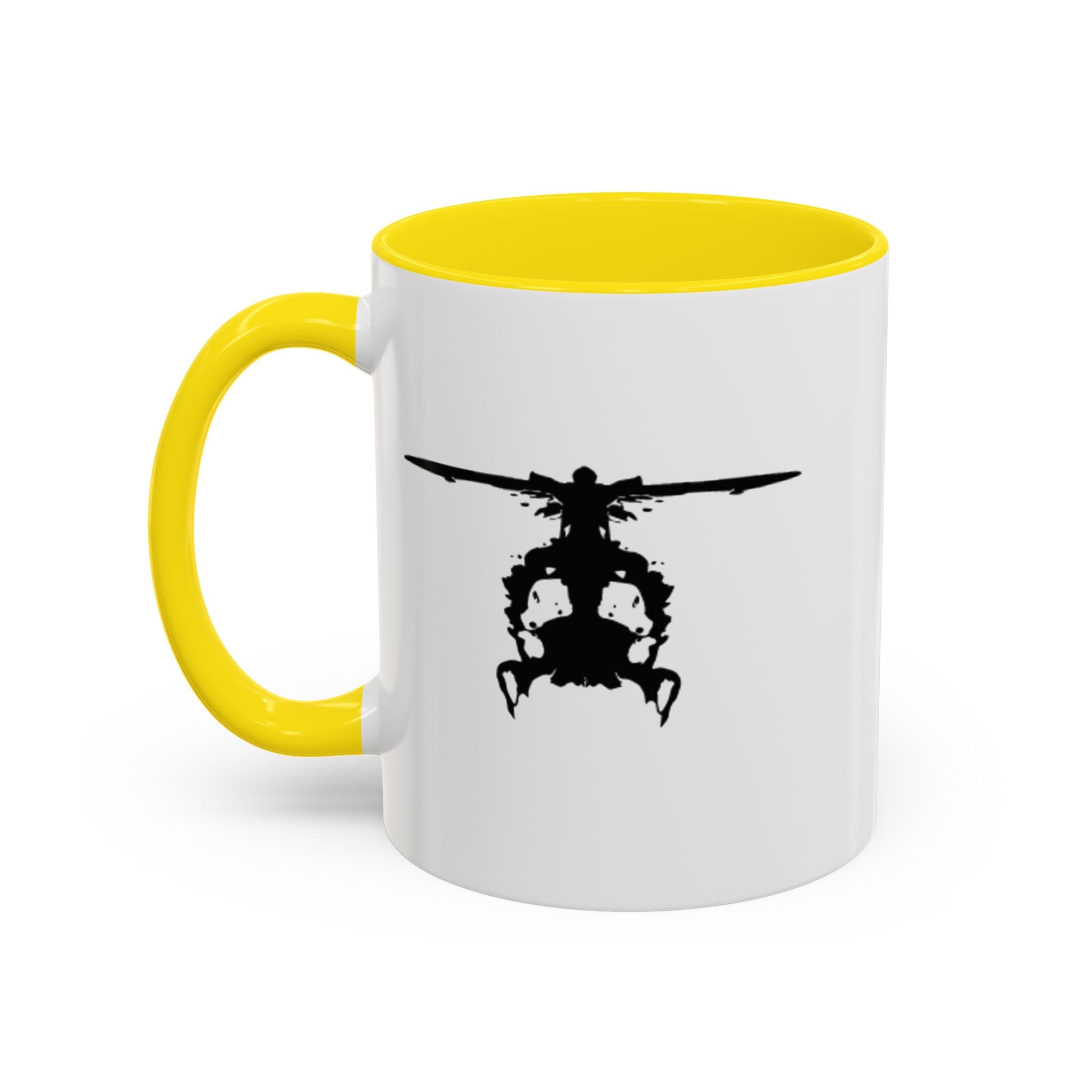 White mug with yellow handle and interior, featuring a black inkblot helicopter design on a white background