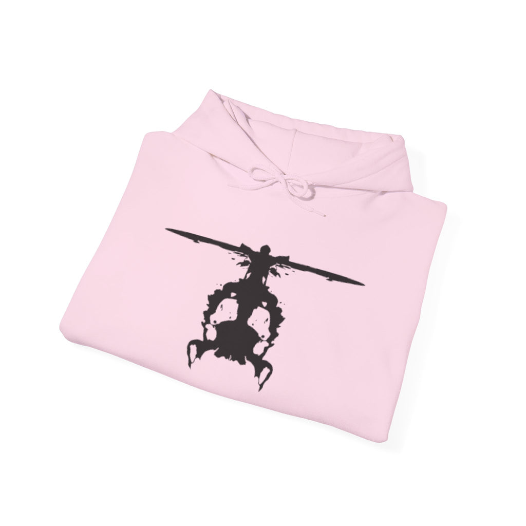 Folded pink hoodie with an inkblot helicopter design on a white background