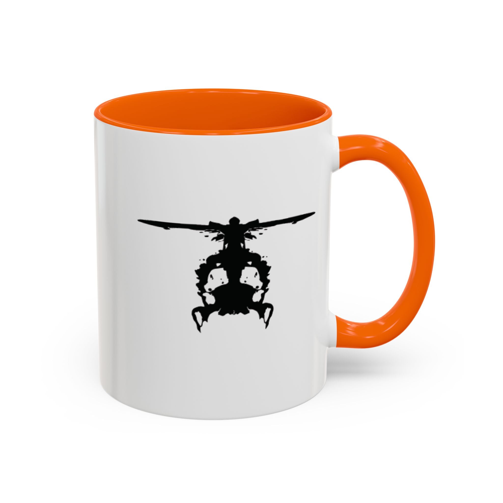 White mug with orange handle and interior, featuring a black inkblot helicopter design on a white background