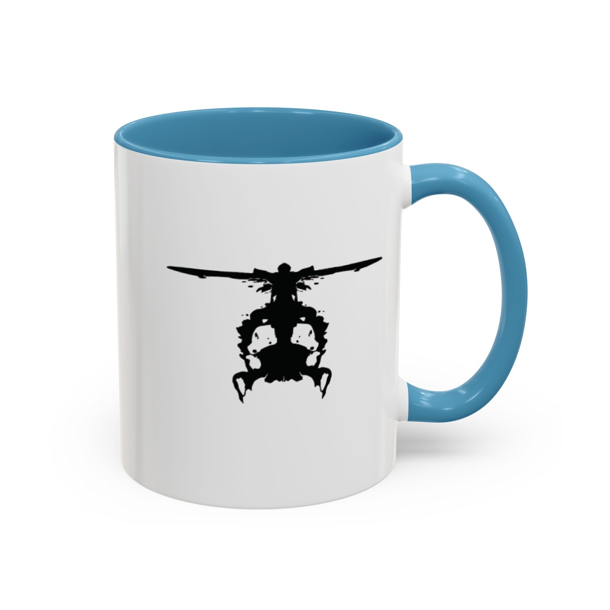 White mug with blue handle and interior, featuring a black inkblot helicopter design on a white background