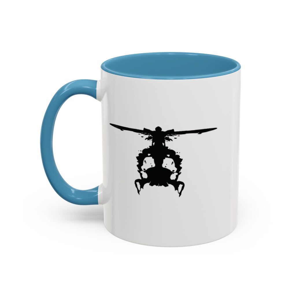 White mug with blue handle and interior, featuring a black inkblot helicopter design on a white background